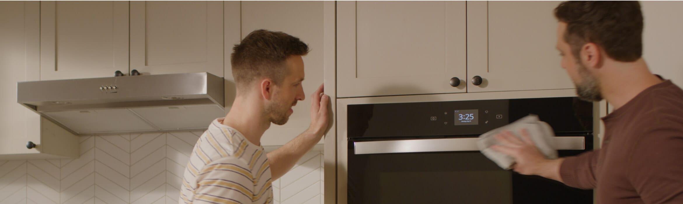 A couple installs a Whirlpool® Microwave