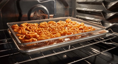 Fries in an Air Fry basket.