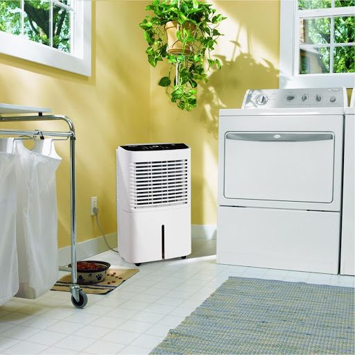 A Whirlpool Portable Dehumidifier in a laundry room