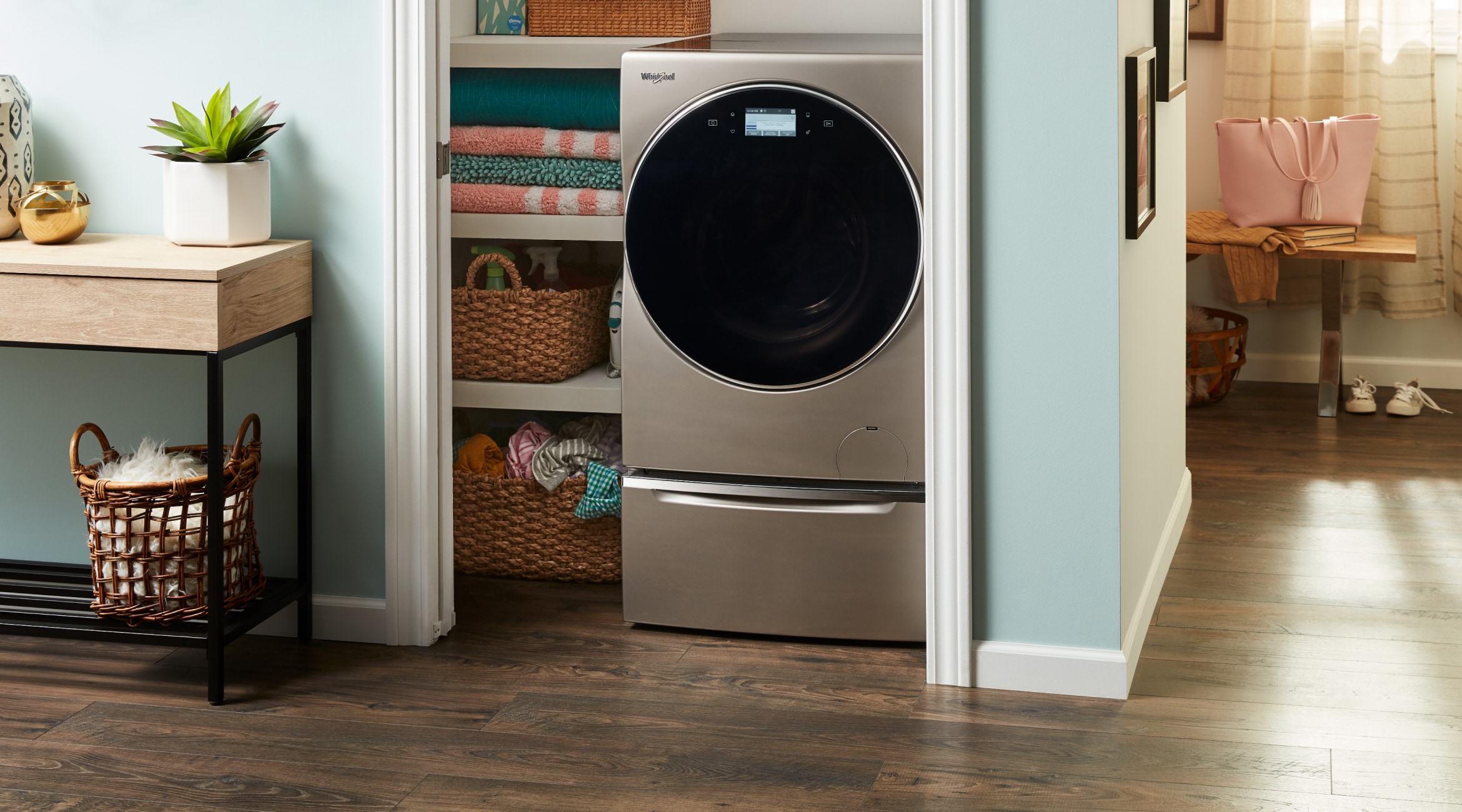 An all-in-one washer and dryer placed in a laundry closet.