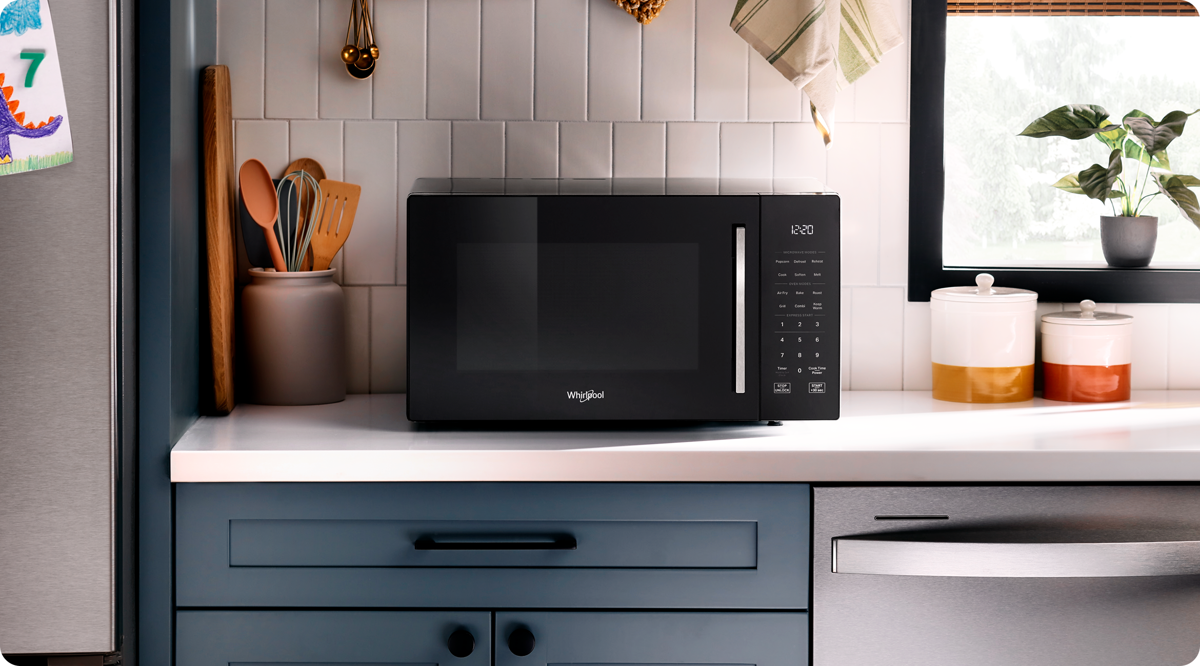 A Whirlpool® Microwave sitting on a kitchen countertop