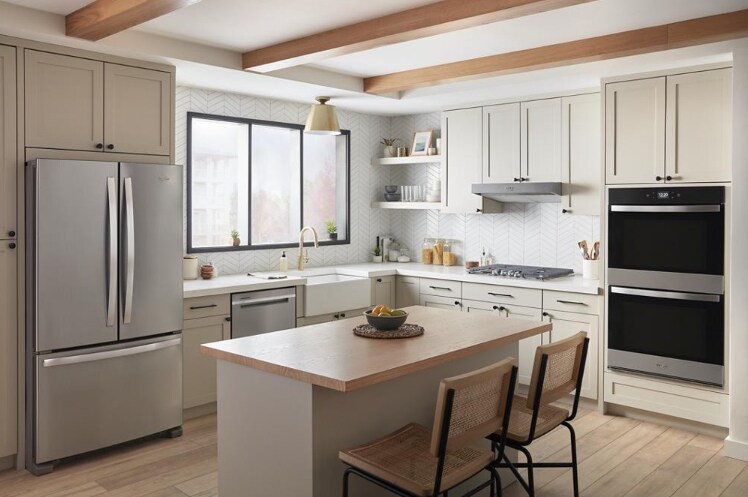 Open kitchen concept with stainless steel appliance suite Open kitchen concept with stainless steel appliance suite