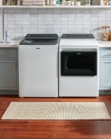 Whirlpool® Front Load Washing Machine in a laundry room