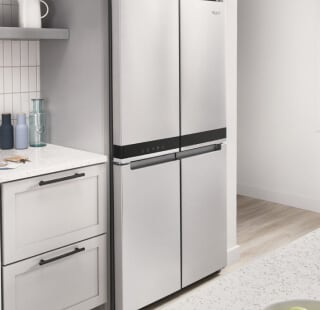 A counter-depth four-door refrigerator in a kitchen