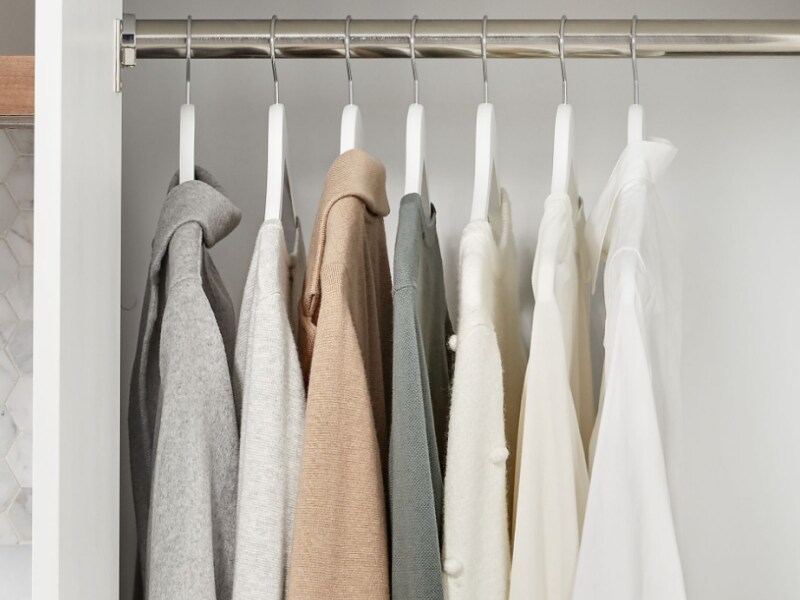 Clothing hung inside a closet Clothing hung inside a closet