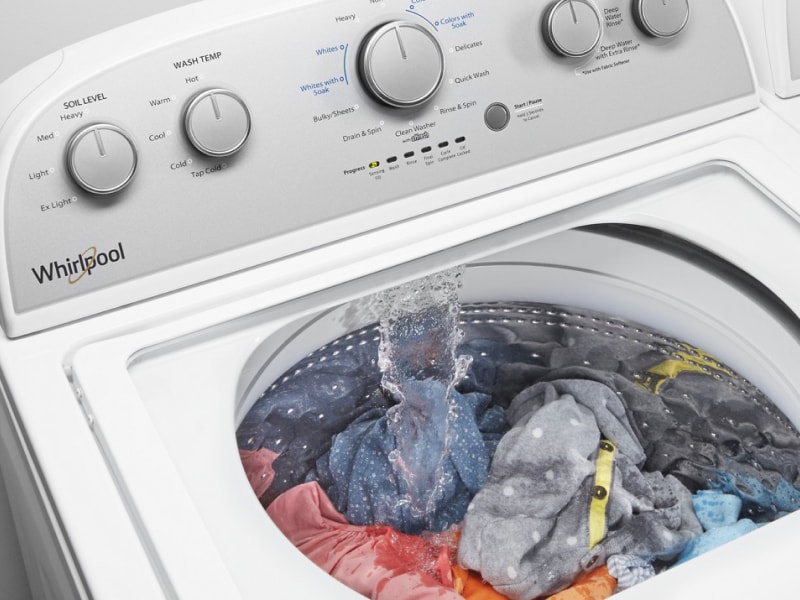 Clothes inside a running washing machine Clothes inside a running washing machine