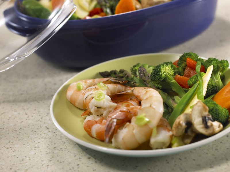 Steamed vegetables on a plate with grilled shrimp Steamed vegetables on a plate with grilled shrimp