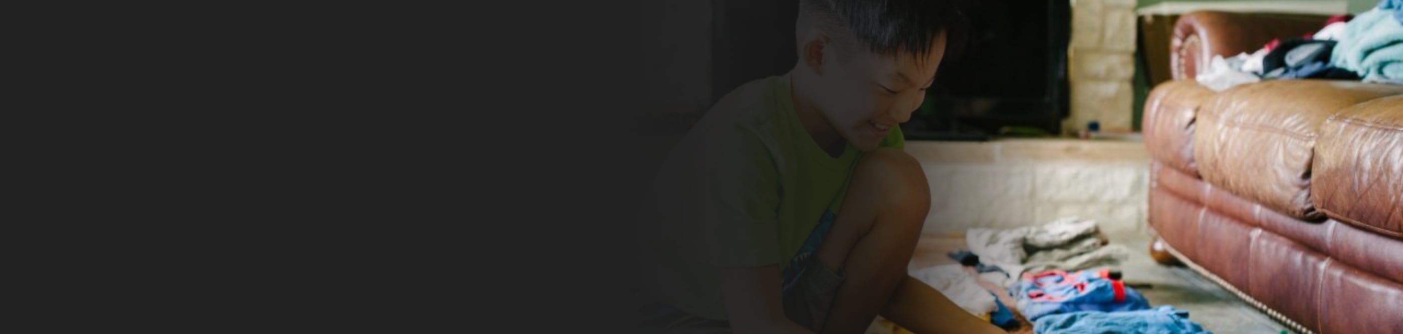 Laundry folded by a couch