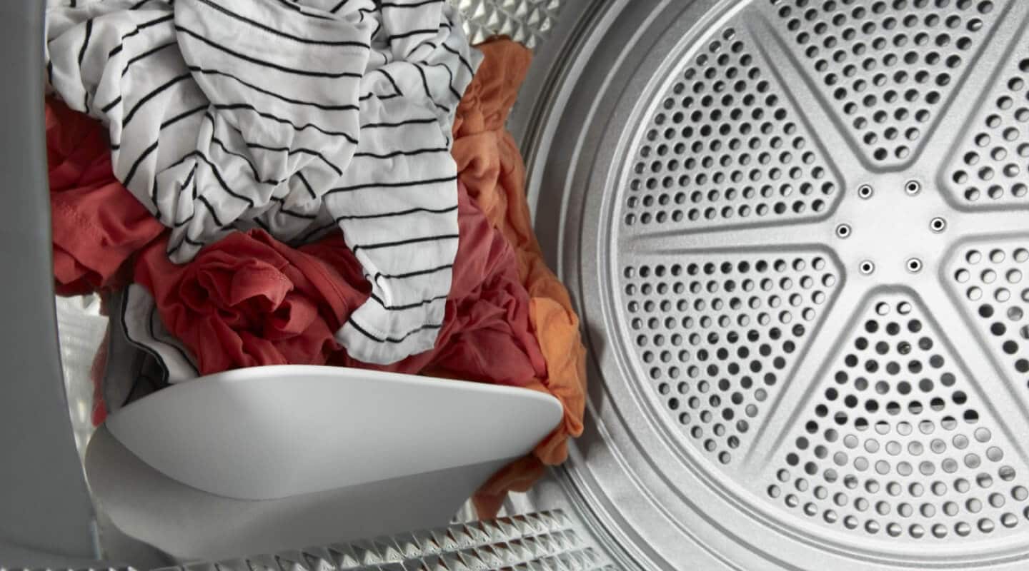 Clothes tumbling inside a dryer Clothes tumbling inside a dryer