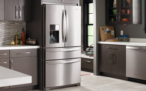 Stainless steel Whirlpool® French Door Refrigerator in brown cabinetry