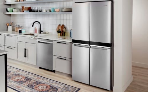 A kitchen with a Whirlpool® 4 Door Refrigerator in stainless steel