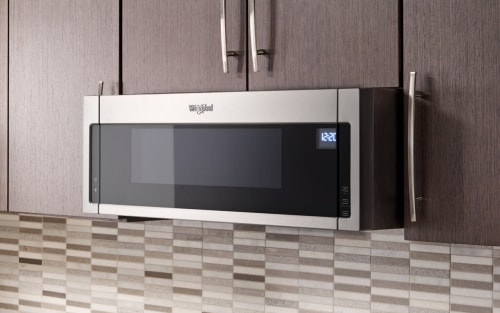 Stainless, Whirlpool® Over-The-Range Microwave in brown cabinetry