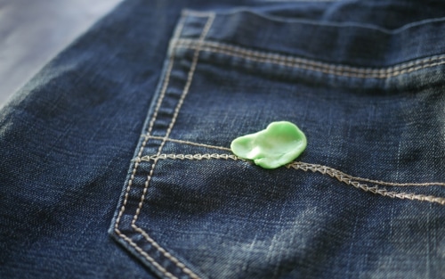 A piece of gum on a pair of jeans